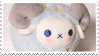 A stamp of a blue ram plushie with horns.